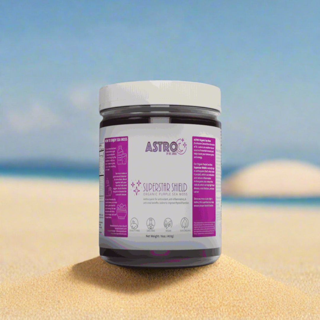 Astro Brand Star Shield Purple Sea Moss Gel 16oz jar on sandy beach backdrop.