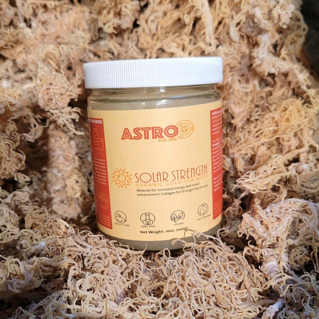 Astro Brand Solar Strength Gold Sea Moss Gel in a clear jar with an orange label, set against a textured background.